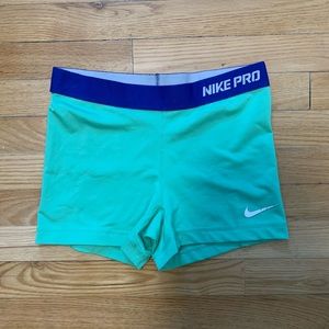 Green and blue Nike pro shorts
